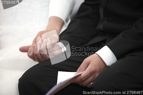 Image of Hands of a bride and groom