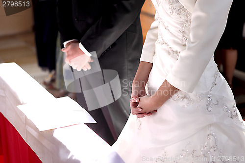 Image of Hands of a bride and groom