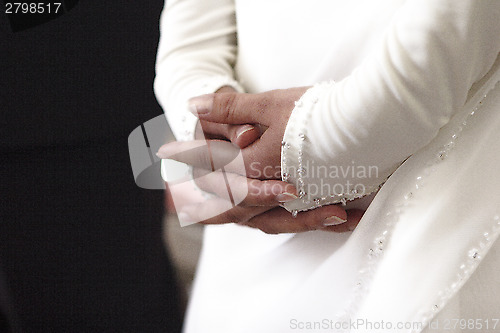 Image of Hands of a bride and groom