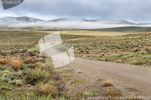 Image of dirt road in a mountain valley