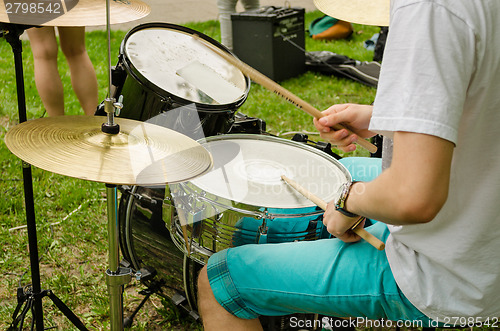 Image of musical drums cymbals hand with wooden sticks drum 