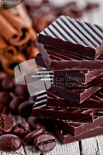 Image of chocolate sweets, cinnamon and coffee beans 