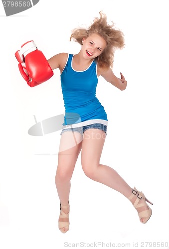 Image of Pretty girl in boxing gloves in jump