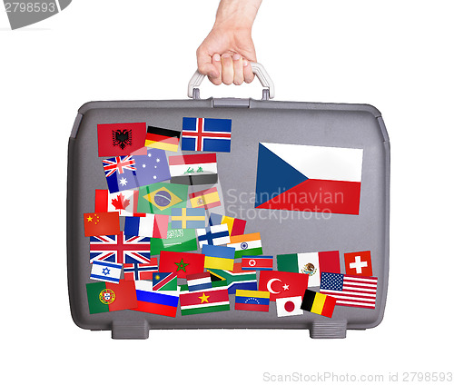 Image of Used plastic suitcase with stickers