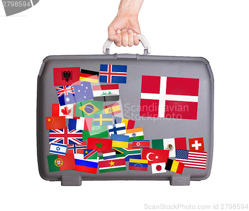 Image of Used plastic suitcase with stickers