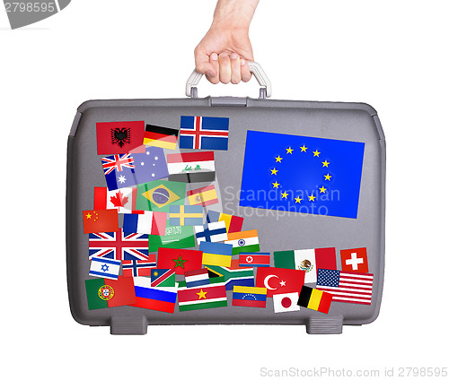 Image of Used plastic suitcase with stickers