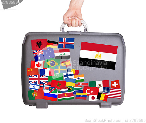 Image of Used plastic suitcase with stickers