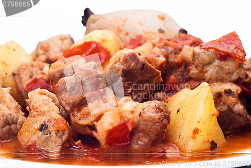 Image of beef stew, potatoes and onion