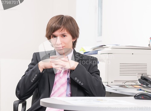 Image of Attractive businessman in office
