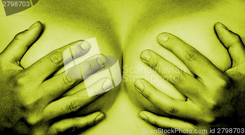 Image of Hands covering breasts