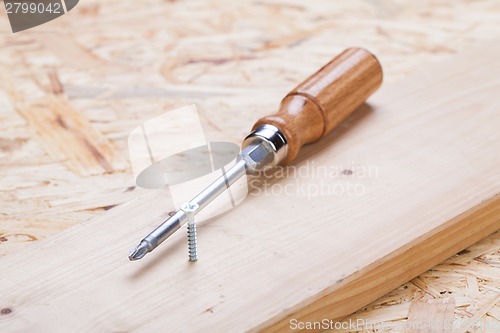 Image of Phillips head screwdriver and wood screws