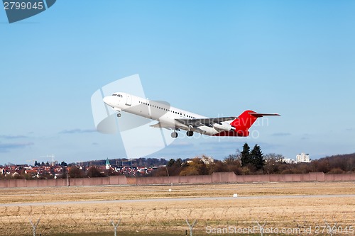 Image of Passenger airliner taking off at an airport