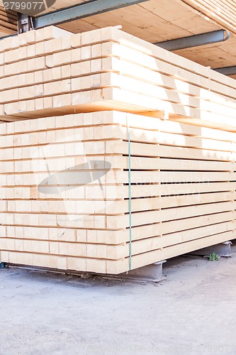 Image of Wooden panels stored inside a warehouse