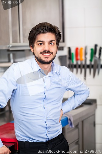 Image of Friendly attractive man in a commercial kitchen