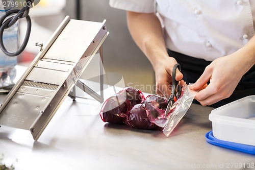 Image of Chef slicing boiled beetroot