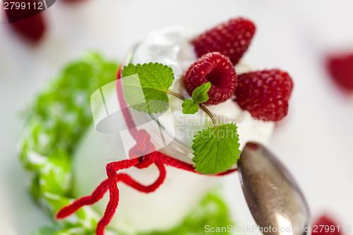 Image of Raspberries and yoghurt or clotted cream