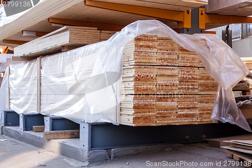 Image of Wooden panels stored inside a warehouse