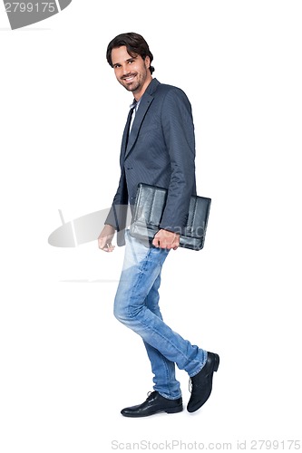 Image of Handsome stylish man carrying a briefcase