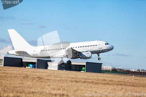 Image of Passenger airliner taking off at an airport