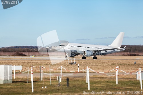 Image of Passenger airliner taking off at an airport