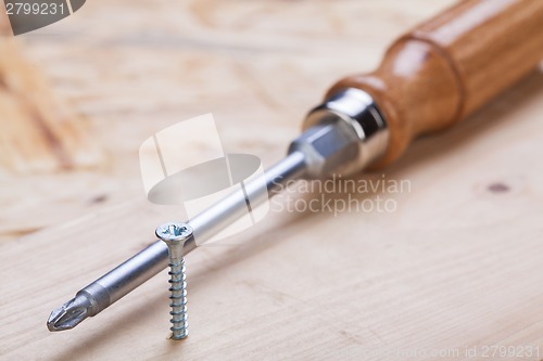 Image of Phillips head screwdriver and wood screws