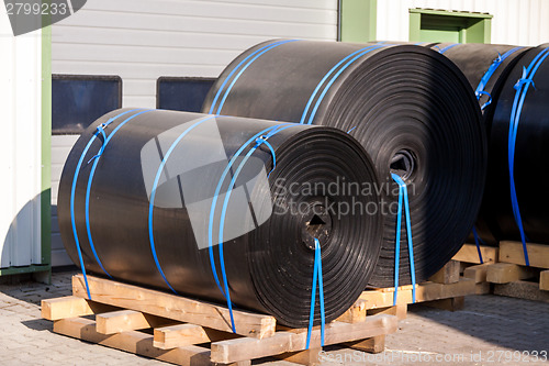 Image of Rolls of black industrial plastic