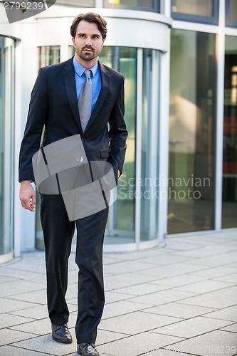 Image of Businessman standing waiting for someone