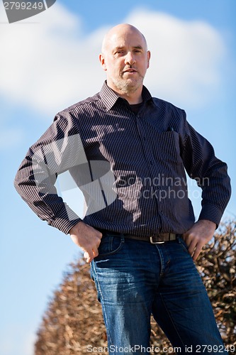 Image of Thoughtful man sitting on a flight of steps