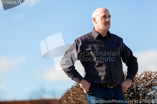 Image of Thoughtful man sitting on a flight of steps