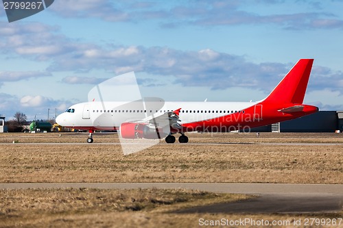 Image of Passenger airliner taking off at an airport