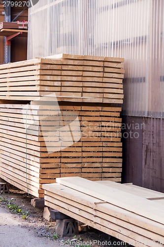 Image of Wooden panels stored inside a warehouse