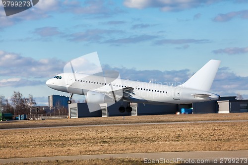 Image of Passenger airliner taking off at an airport