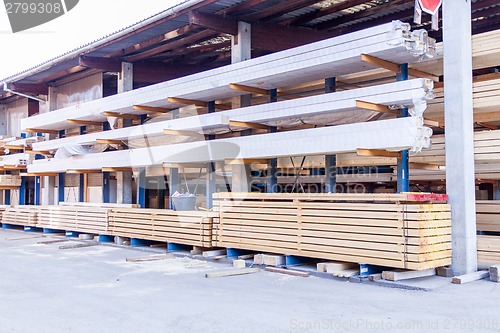 Image of Wooden panels stored inside a warehouse