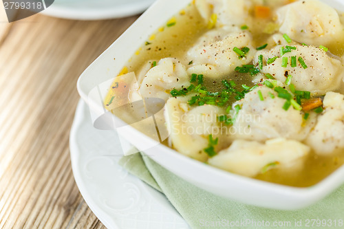 Image of Dish of savory pork tortellini in broth pelmeni russian