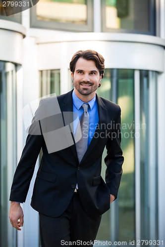 Image of Businessman standing waiting for someone