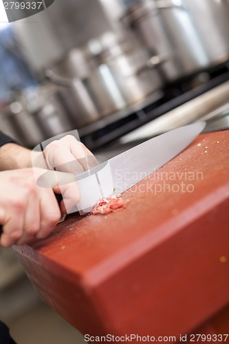 Image of Chef or butcher dicing meat