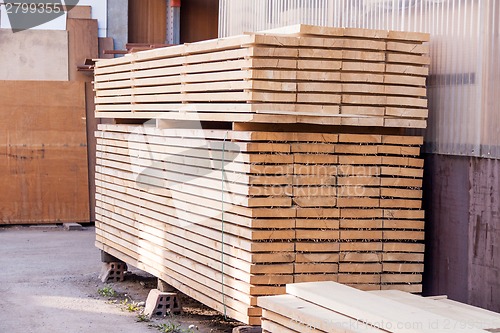 Image of Wooden panels stored inside a warehouse