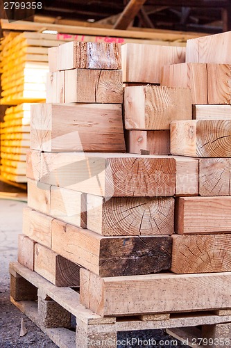 Image of Wooden panels stored inside a warehouse