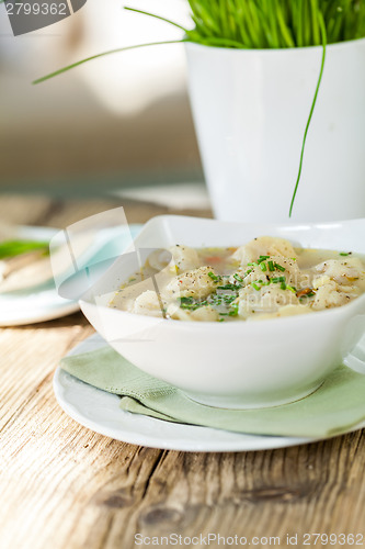 Image of Dish of savory pork tortellini in broth pelmeni russian