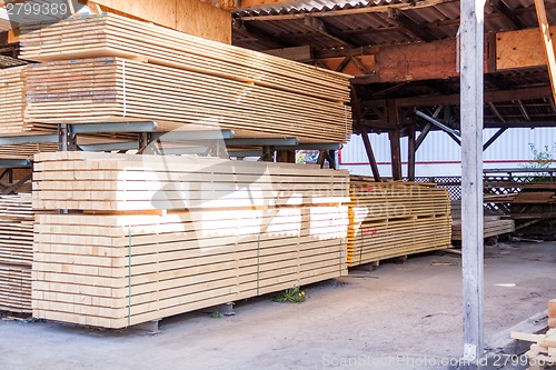 Image of Wooden panels stored inside a warehouse