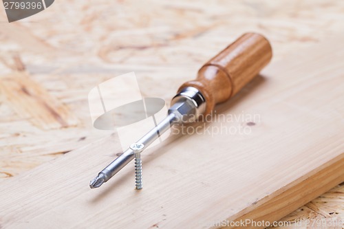 Image of Phillips head screwdriver and wood screws