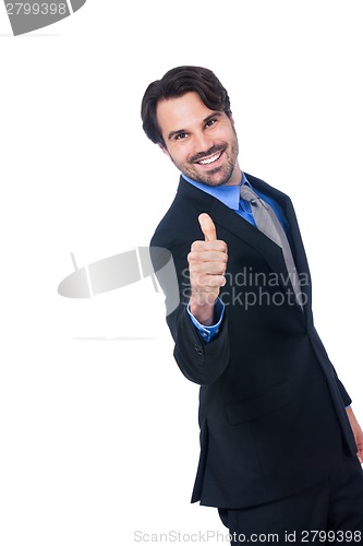 Image of Enthusiastic businessman giving a thumbs up