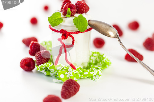 Image of Raspberries and yoghurt or clotted cream