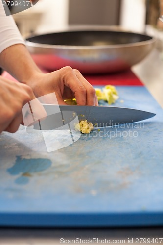 Image of Chef chopping salad ingredients