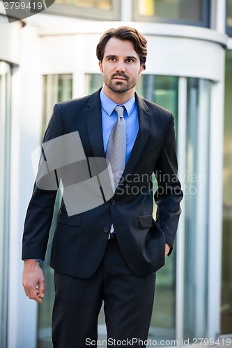 Image of Businessman standing waiting for someone