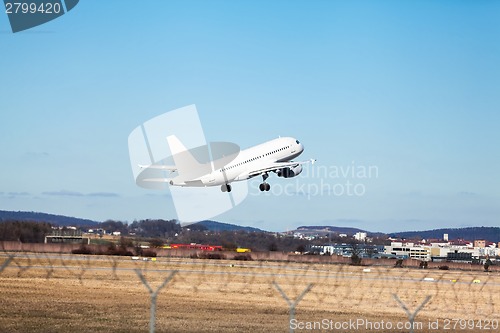 Image of Passenger airliner taking off at an airport