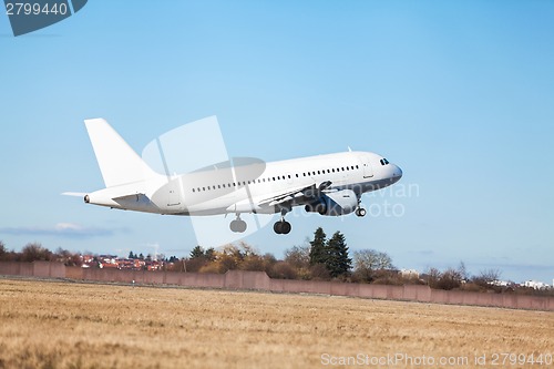 Image of Passenger airliner taking off at an airport