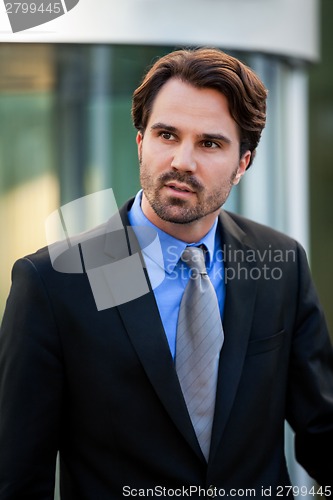 Image of Businessman standing waiting for someone