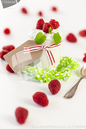 Image of Raspberries and yoghurt or clotted cream