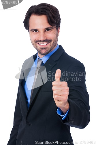 Image of Enthusiastic businessman giving a thumbs up